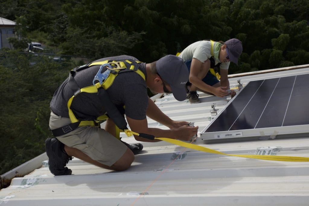 installation solar panels on metal roof with bracket